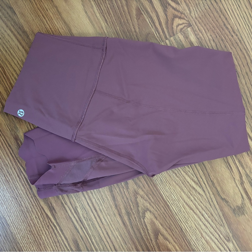 Lululemon, plum colored high rise above ankle leggings, size 26